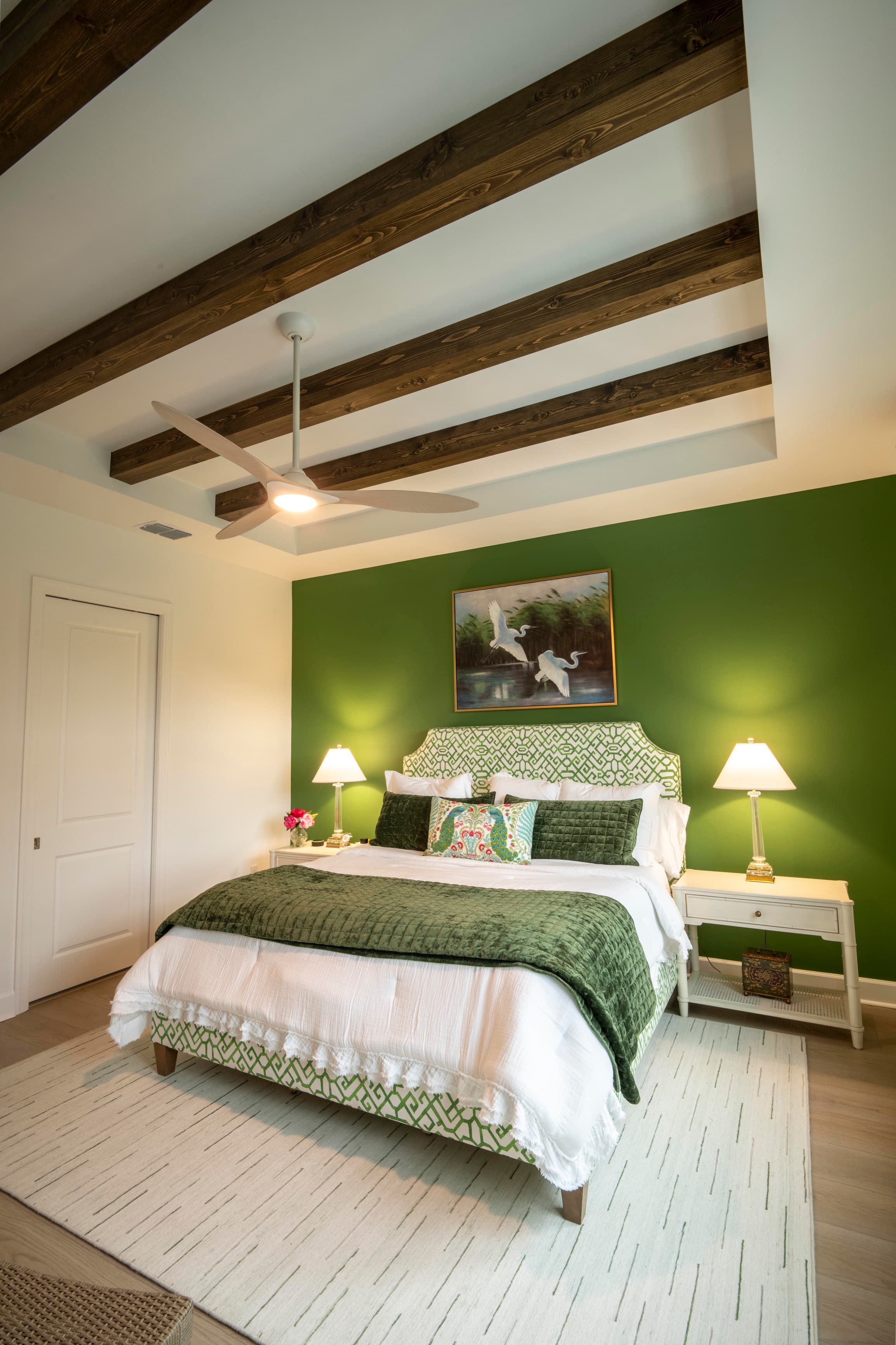 Bedroom beams coordinated with lighting and fan